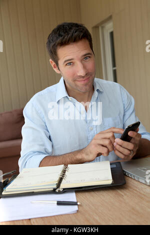 Self-employed person working from home Stock Photo