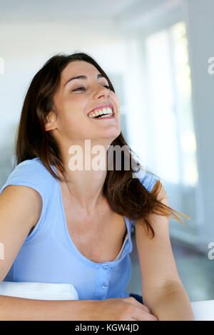 Beautiful brunette girl laughing outloud Stock Photo