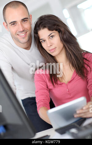 Office workers using electronic tablet Stock Photo