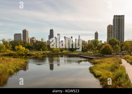 Chicago skyline partially reflected in a Lincoln Park lagoon. Stock Photo