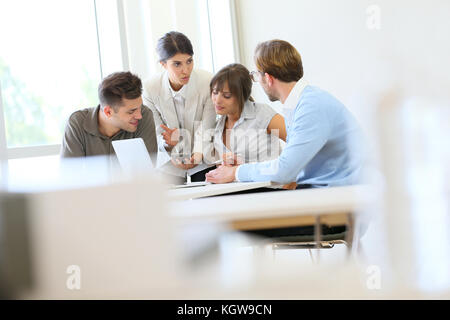 Business people meeting around table Stock Photo
