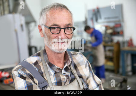 Portrait of smiling senior ironworker Stock Photo