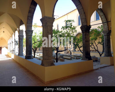 Fondi, Italy - 10 june 2013: Cloister of the convent of St. Francis. Fondi's urban core is located in the south pontino halfway between Rome and Naple Stock Photo