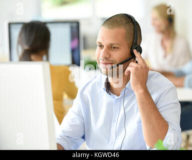 Customer service operator working in office Stock Photo