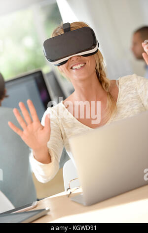 Office-worker using VR headset, 3D, virtual reality Stock Photo