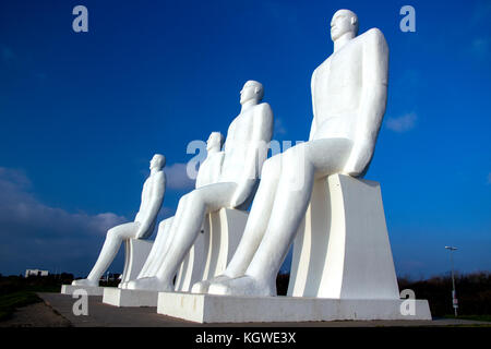 ESBJERG - NOVEMBER 9 2017: The Men at Sea is a monument of four 9 meter tall white males, located in Esbjerg, Denmark on the Beach. The sculpture was  Stock Photo