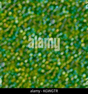 Abstract green glitter soft focus background. Seamless texture.  Stock Photo