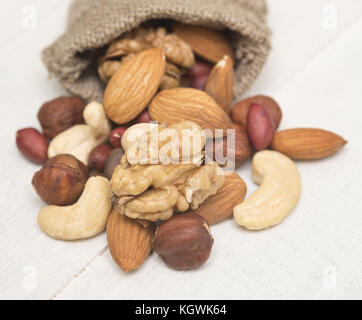 mixed nuts on wooden background Stock Photo