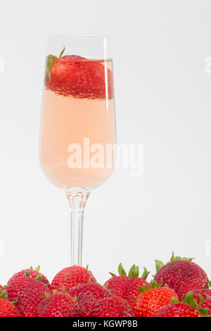 fresh strawberry on a glass filled with wine Stock Photo