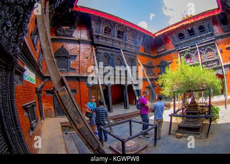 KATHMANDU, NEPAL OCTOBER 10, 2017: Unidentified people walking in front of the Kumari Ghar, built in 1757 in Kathmandu, Nepal. Photos are permitted in the courtyard but strictly prohibited to photograph Kumari Stock Photo