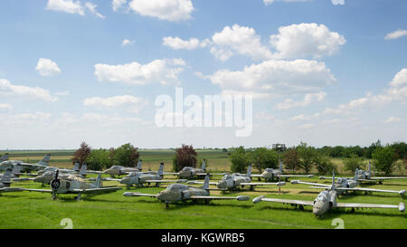 Old military fighter jets in the field Stock Photo
