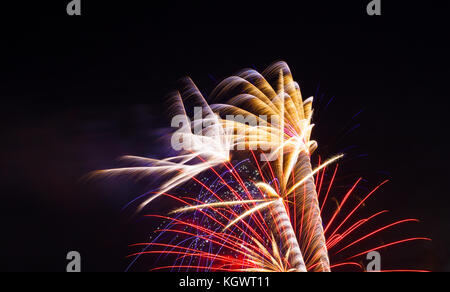 Fireworks exploding on a dark sky/ Fireworks on black background Stock Photo