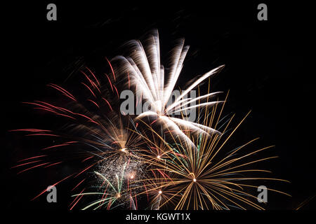 Fireworks exploding on a dark sky/ Fireworks on black background Stock Photo