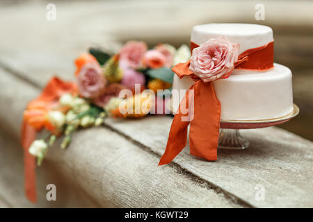 white wedding cake with red flower Stock Photo