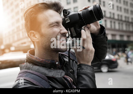 Tourist in New york city taking pictures with photo camera Stock Photo