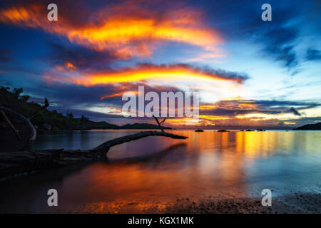 red shining sky after the sunset on the seychelles. Stock Photo