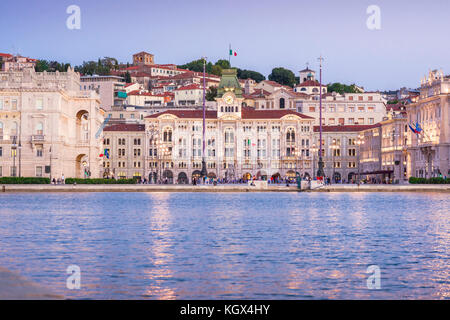 Trieste Italy city, view at dusk of the Town Hall and Piazza Unita d'Italia facing the harbor in the centre of Trieste, Italy. Stock Photo