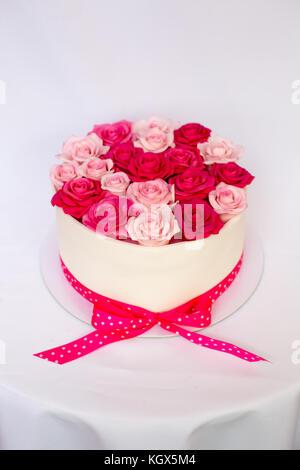 Pink marzipan roses on a cake Stock Photo