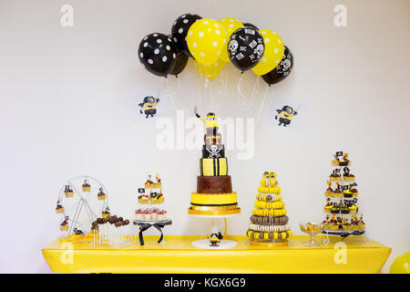 Birthday party sweets table for boy in yellow and black pirate theme Stock Photo