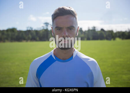 Portrait of football player standing in the ground Stock Photo