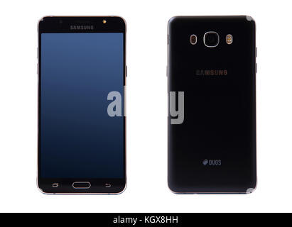 New York, USA - October 29, 2017: Front and back sides of Samsung galaxy J7 smartphone isolated on white background. Stock Photo