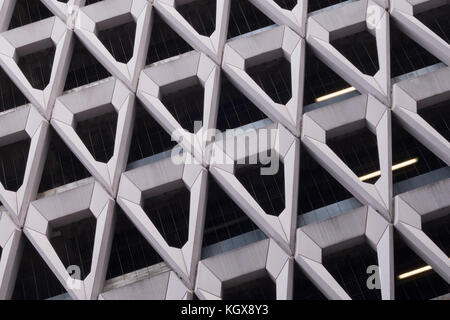 Detail of brutalist concrete diamond shaped facade of the car park in Welbeck Street , London. Stock Photo