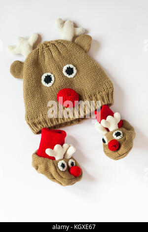 Christmas baby's reindeer hat and booties isolated on white background Stock Photo