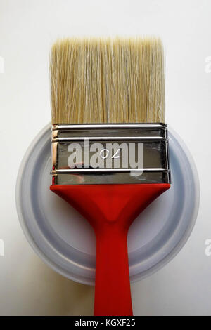 Red Paint Brush on top of Can Stock Photo