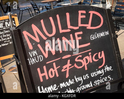 A sign advertising the sale of mulled wine outside an off licence in Cambridge UK Stock Photo