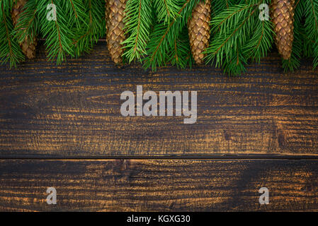 Christmas decoration concept - spruce branches on an old wooden vintage planks with copy space ( high details). Stock Photo