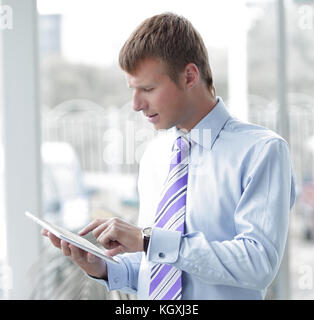 portrait of senior business executive using tablet pc Stock Photo