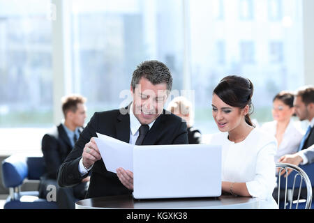 business partners discussing documents, sitting at the table.photo with copy space Stock Photo