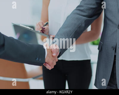Successful handshake of business men in a working environment Stock Photo