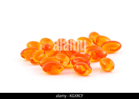 orange dha pill heap isolated on white background Stock Photo