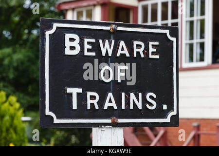 Beware of Trains.  A 'Beware of Trains' sign on the South Tynedale railway in Northern England. Stock Photo