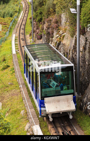 A train on the Funicular Railway in Bergen, Norway, is seen climbing Mount Floyen. Stock Photo