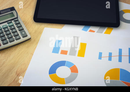 financial chart with calculator and digital tablet Stock Photo
