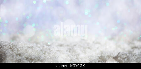 Abstract cold winter background with snow and defocused lights Stock Photo