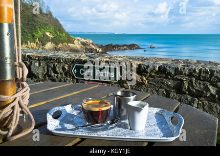 dh Coastal path FERMAIN BAY GUERNSEY Cafe outdoor coffee cup cliff path sign for coast footpath sea Stock Photo