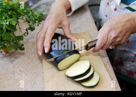 Eggplant slicing detail Stock Photo