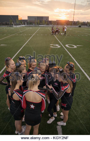 A cheerleader huddle Stock Photo - Alamy