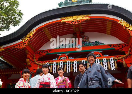 Young Japanese boys dressed in traditional kimonos the main entrance of Fushimi Inari, in Kyoto Stock Photo