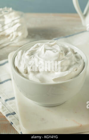 Sweet Homemade Vanilla Whipped Cream in a Bowl Stock Photo