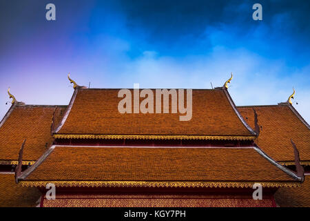 Red roof of Buddhist temple in Thailand Stock Photo