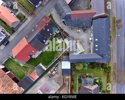 Strictly downward facing view of large residential buildings in a village near Wolfsburg, Germany, aerial view with drone Stock Photo