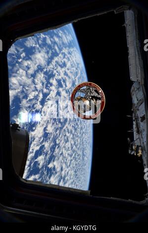 International Space Station. 10th Nov, 2017. Expedition 53 American astronaut Randy Bresnik celebrates the birthday of the U.S. Marine Corps by flying a USMC coin in the cupola of the International Space Station for storage November 10, 2017 in Earth Orbit. Credit: Planetpix/Alamy Live News Stock Photo
