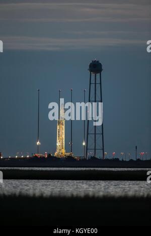 The Orbital ATK Antares rocket is readied for launch Pad-0A at Wallops Flight Facility November 10, 2017 in Wattsville, Virginia. The rocket will carry over 7,400 pounds of supplies to the International Space Station. Stock Photo