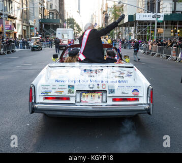 New York, NY - November 11, 2017: Grand marshal NASA astronaut Buzz Aldrin rides vintage Eldorado Cadillac at New York 99th annual Veterans Day Parade on 5th Avenue Stock Photo