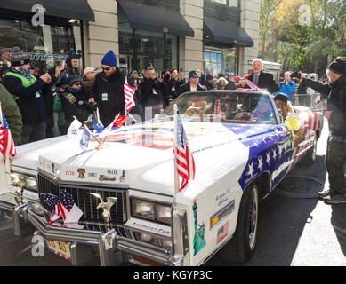 New York, NY - November 11, 2017: Grand marshal NASA astronaut Buzz Aldrin rides vintage Eldorado Cadillac at New York 99th annual Veterans Day Parade on 5th Avenue Stock Photo