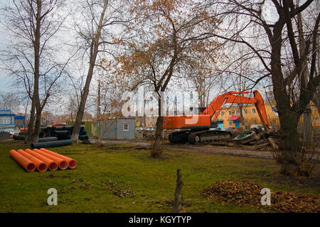 Pipes of PVC large diameter prepared for laying on construction site Stock Photo